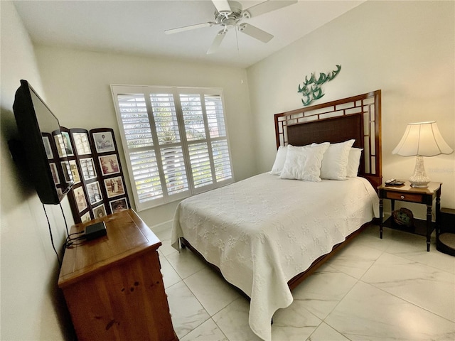 bedroom featuring multiple windows and ceiling fan