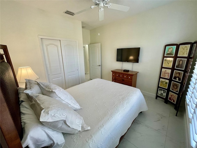 bedroom with ceiling fan and a closet