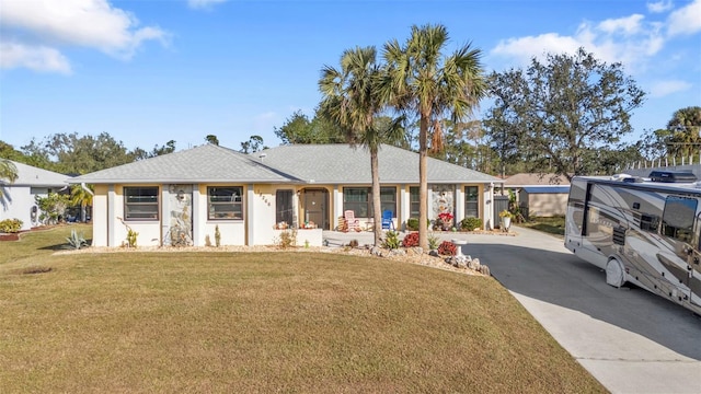 ranch-style house with a front lawn