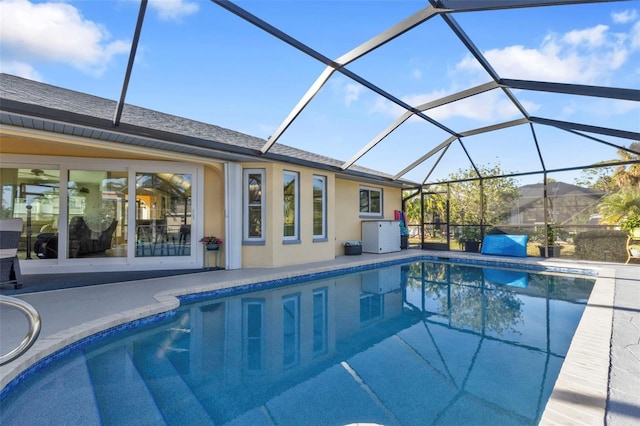 view of pool featuring a lanai and a patio