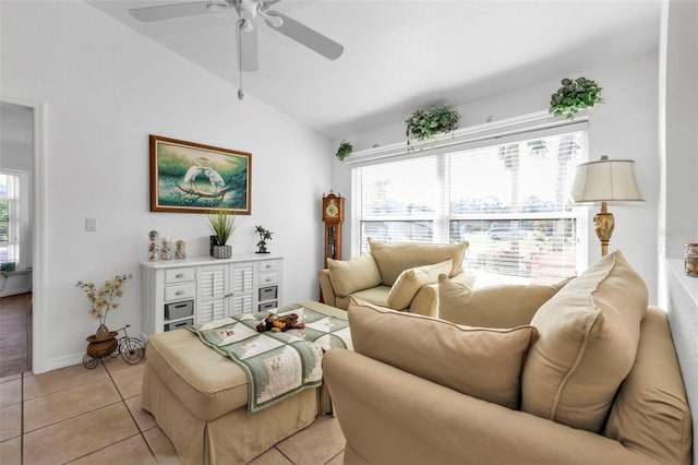 tiled living room featuring ceiling fan and vaulted ceiling