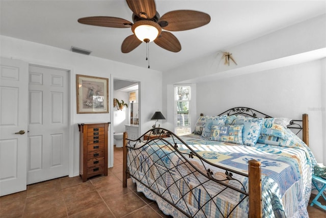 tiled bedroom with ceiling fan and a closet