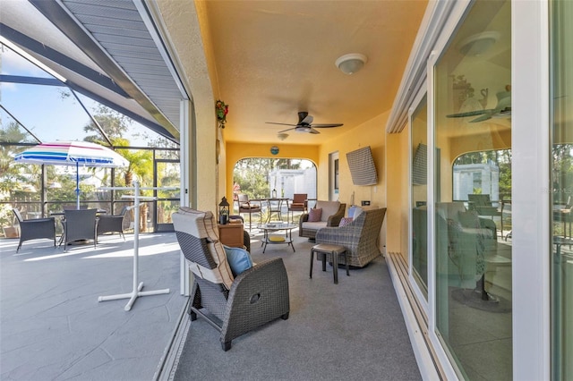 view of patio featuring ceiling fan