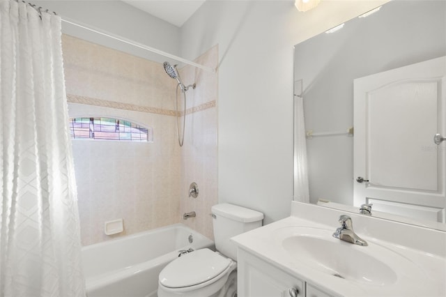 full bathroom featuring shower / bath combo with shower curtain, vanity, and toilet