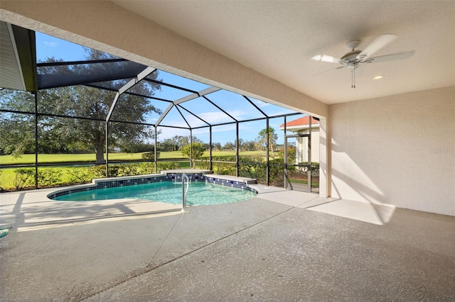 view of pool with glass enclosure, ceiling fan, and a patio area