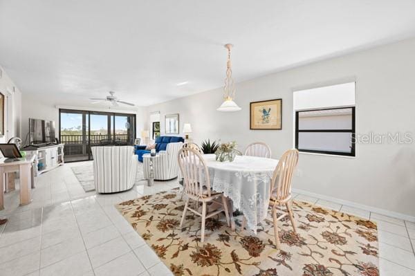 dining area featuring light tile patterned floors and ceiling fan