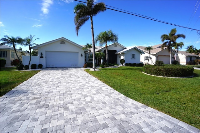 ranch-style home with a front yard and a garage