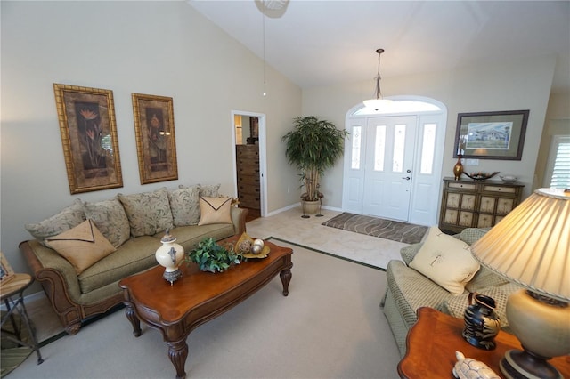 living room with carpet floors and high vaulted ceiling