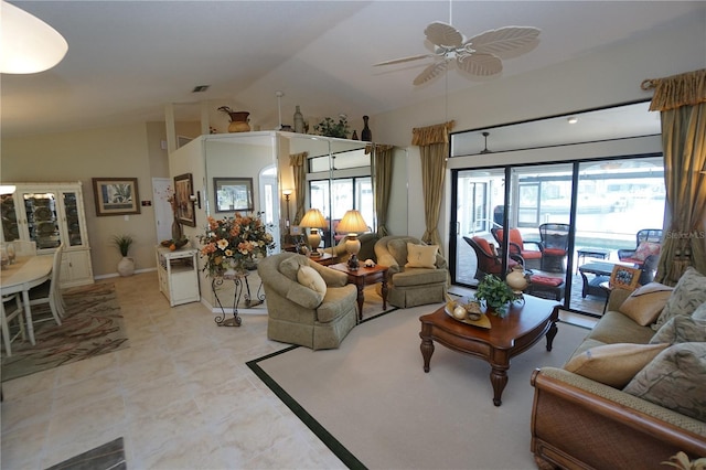 living room featuring ceiling fan and vaulted ceiling