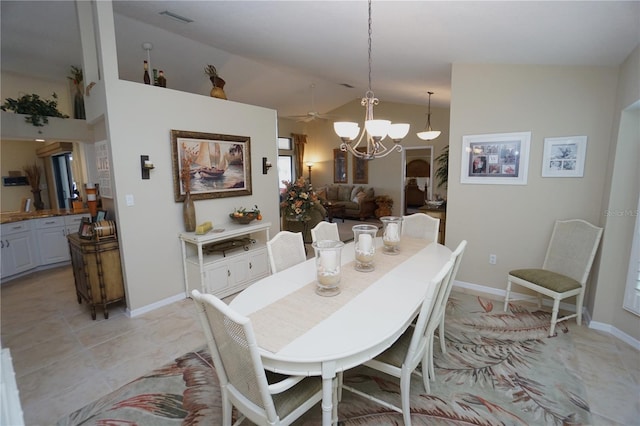 dining space with high vaulted ceiling and ceiling fan with notable chandelier