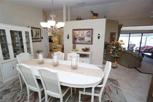 dining room with a notable chandelier