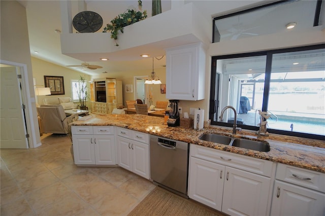 kitchen with light stone countertops, stainless steel dishwasher, sink, pendant lighting, and white cabinetry