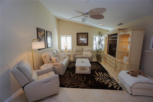 living room featuring ceiling fan and vaulted ceiling