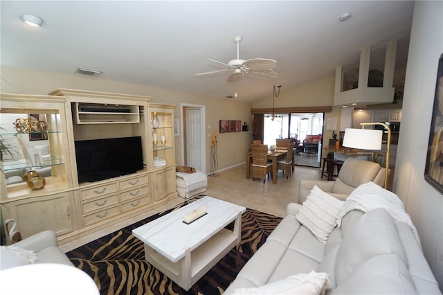 living room with light tile patterned floors, ceiling fan, and lofted ceiling