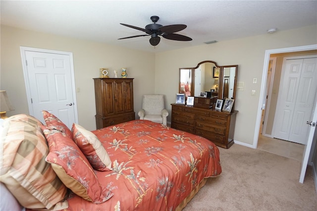 bedroom featuring ceiling fan and light colored carpet