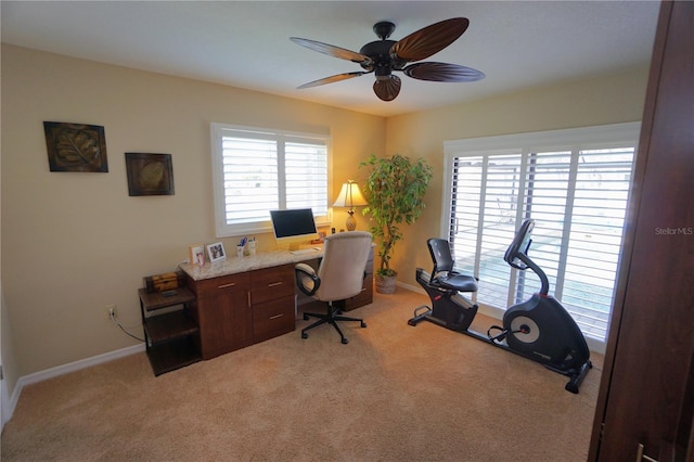 office featuring ceiling fan and light colored carpet