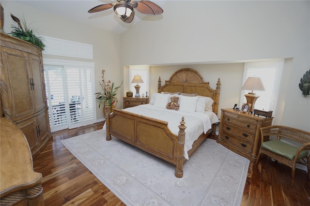 bedroom with hardwood / wood-style floors, access to outside, and ceiling fan