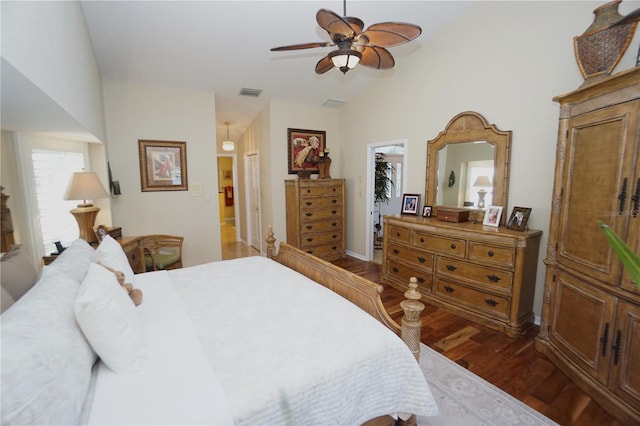 bedroom featuring ceiling fan, wood-type flooring, vaulted ceiling, and a spacious closet