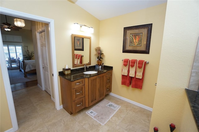 bathroom with vanity, vaulted ceiling, and ceiling fan