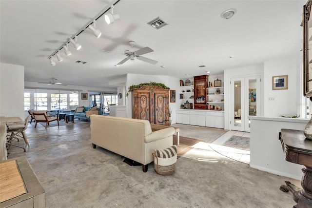 living room with ceiling fan and track lighting