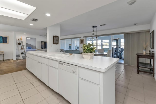 kitchen with sink, light tile patterned flooring, white dishwasher, a kitchen island with sink, and white cabinets