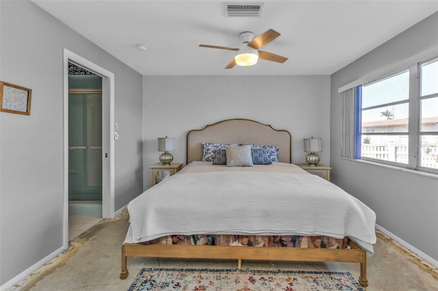 bedroom with ceiling fan and ensuite bath