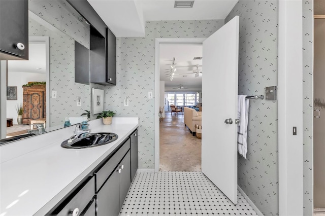 kitchen with light carpet, ceiling fan, and sink