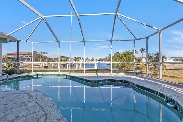 view of swimming pool featuring a lanai, a water view, and a patio