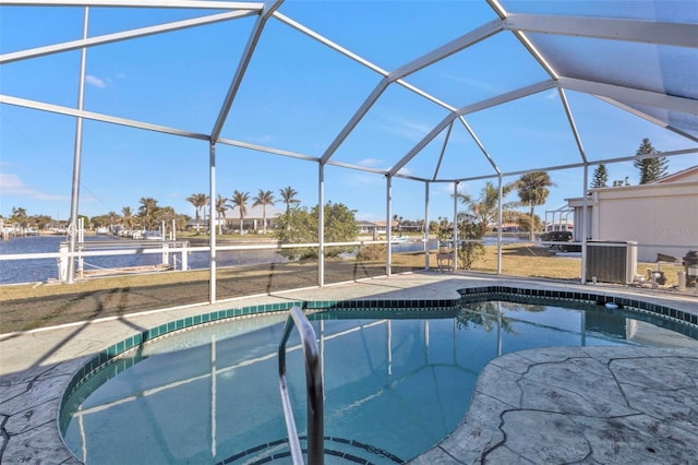 view of swimming pool with a patio and glass enclosure