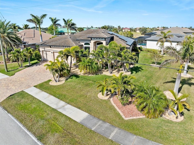 view of front of property with a garage and a front yard