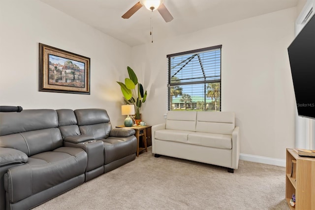 living room with ceiling fan and light carpet