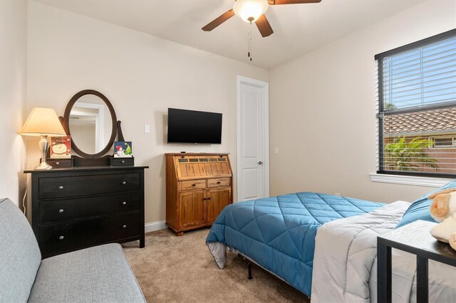 carpeted bedroom with ceiling fan