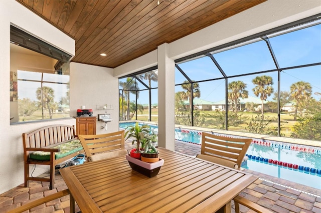 sunroom / solarium with a swimming pool and wooden ceiling