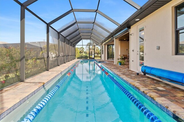 view of pool with a patio and a lanai