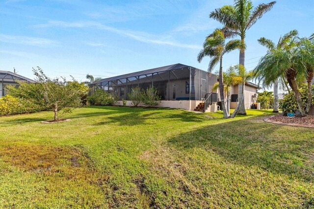 view of yard with a lanai