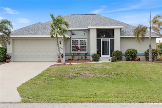 single story home featuring a garage and a front lawn