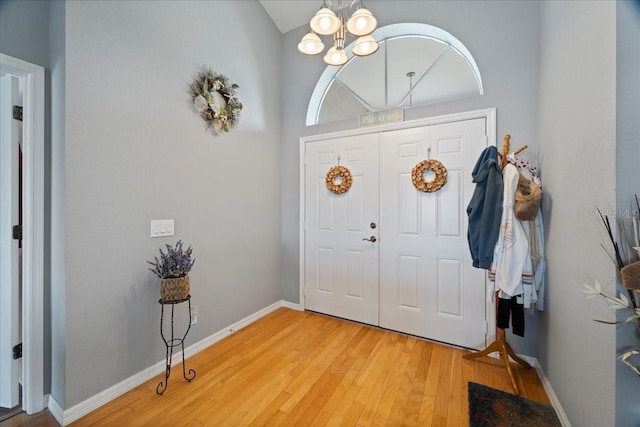 foyer entrance featuring a chandelier and light wood-type flooring