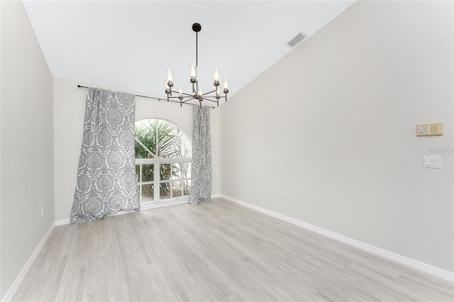 interior space with a chandelier and light hardwood / wood-style flooring