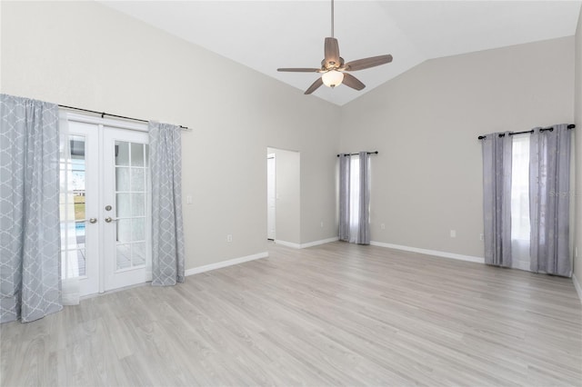 unfurnished room with ceiling fan, french doors, high vaulted ceiling, and light hardwood / wood-style flooring