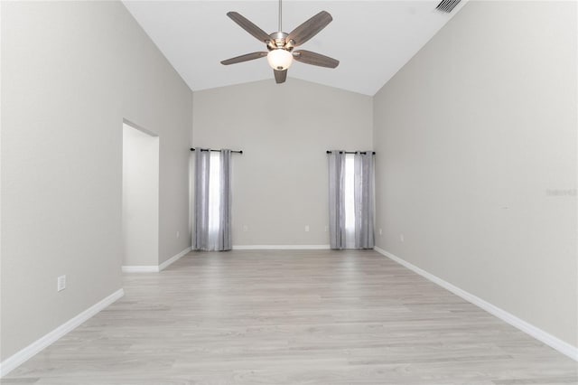 unfurnished room featuring ceiling fan, high vaulted ceiling, and light wood-type flooring