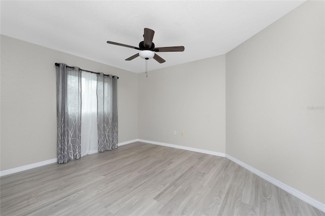 unfurnished room featuring light wood-type flooring and ceiling fan