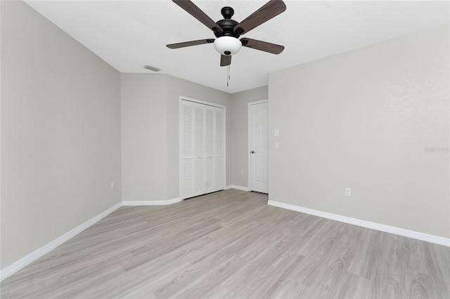 unfurnished bedroom with ceiling fan, a closet, and light hardwood / wood-style floors