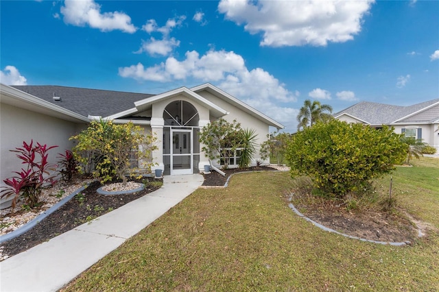 view of front of home with a front lawn