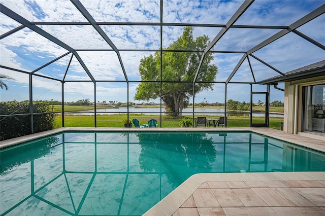 view of pool with a water view and a lanai