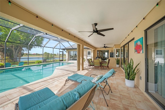 view of pool with glass enclosure, an outdoor living space, a patio area, and a water view