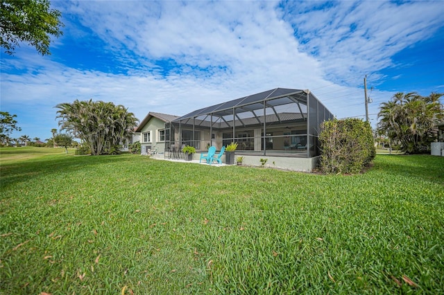 view of yard with glass enclosure