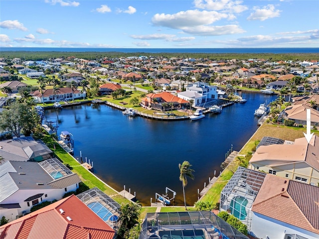 birds eye view of property with a water view