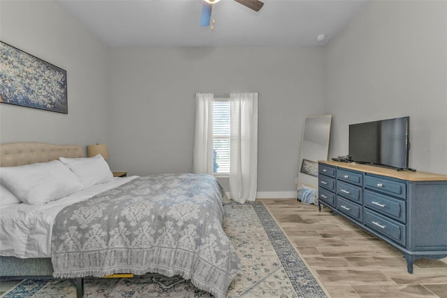 bedroom with light wood-type flooring and ceiling fan