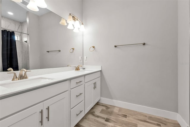 bathroom with vanity and curtained shower