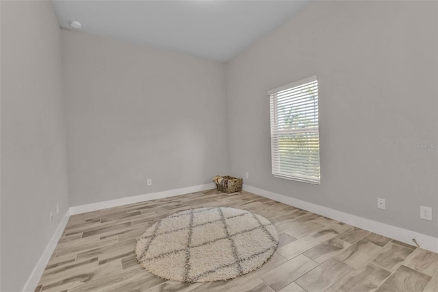 spare room featuring light hardwood / wood-style flooring